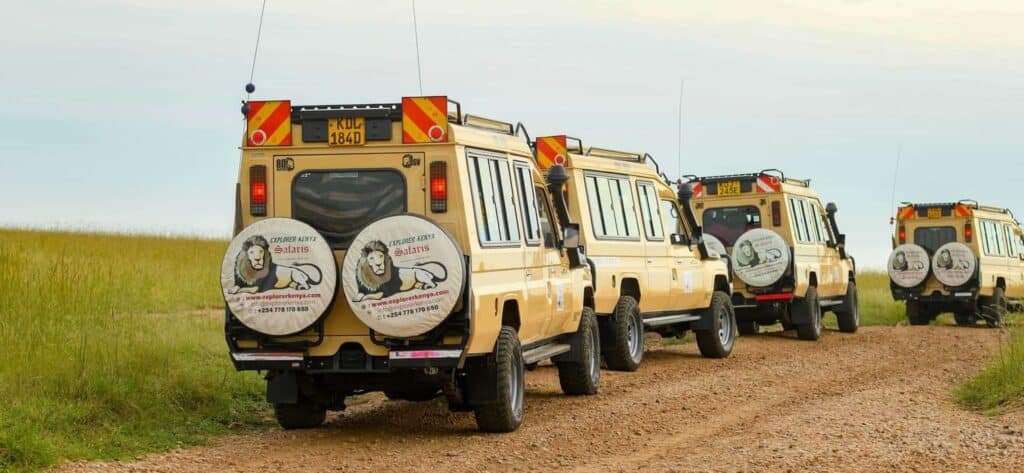 Explorer Kenya 4x4 safari Land Cruisers on a game drive in the Masai Mara