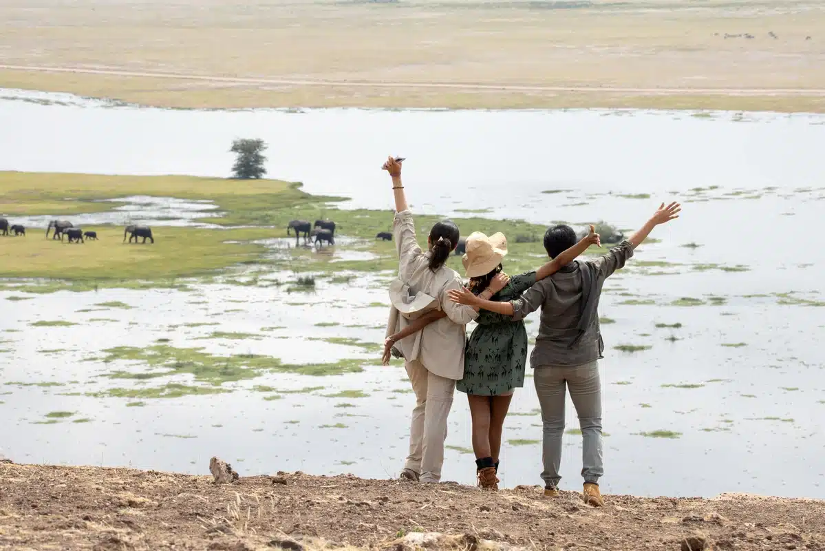 Travellers enjoying the view over the Amboseli swamps from Observation Hill